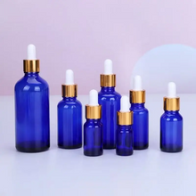 Load image into Gallery viewer, Blue or Green Chromotherapy Colored Glass Water Altar Bottles
