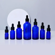 Load image into Gallery viewer, Blue or Green Chromotherapy Colored Glass Water Altar Bottles

