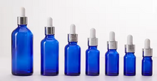 Load image into Gallery viewer, Blue or Green Chromotherapy Colored Glass Water Altar Bottles
